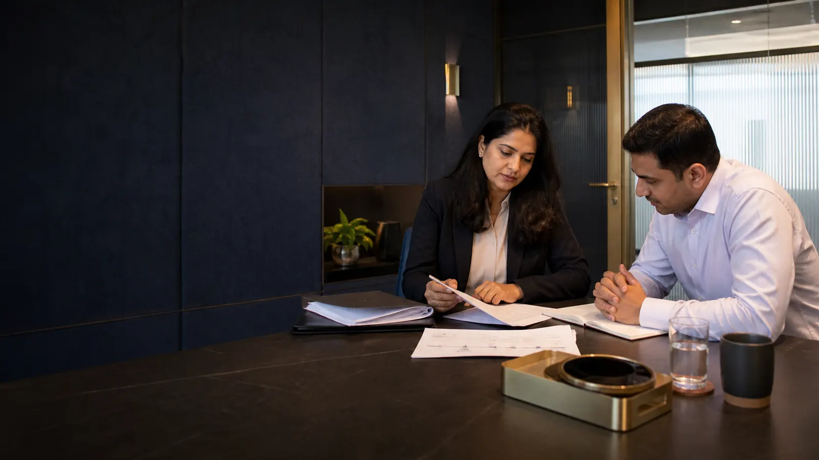 A confidential employment-law consultation in a Bengaluru office
